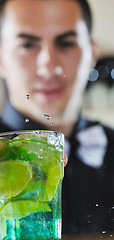 Image showing pro barman prepare coctail drink on party