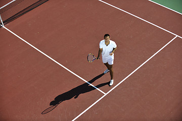 Image showing young woman play tennis outdoor