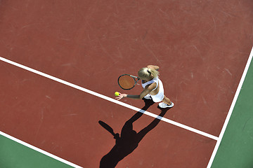 Image showing young woman play tennis outdoor