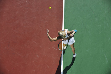 Image showing young woman play tennis outdoor