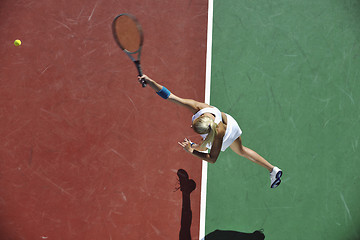 Image showing young woman play tennis outdoor