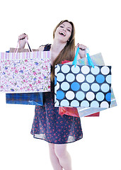 Image showing happy young adult women  shopping with colored bags