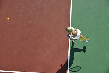 Image showing young woman play tennis outdoor