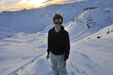 Image showing happy young man have fun at winter on mountain peak