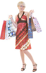 Image showing happy young adult women  shopping with colored bags