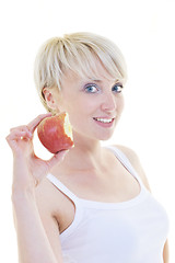 Image showing happy  young  woman eat green apple isolated  on white