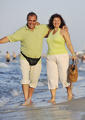 Image showing happy seniors couple  on beach