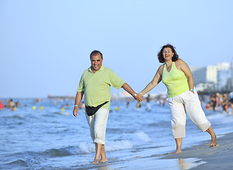 Image showing happy seniors couple  on beach