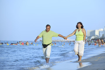 Image showing happy seniors couple  on beach