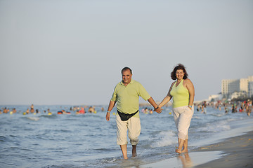 Image showing happy seniors couple  on beach