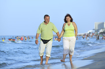 Image showing happy seniors couple  on beach