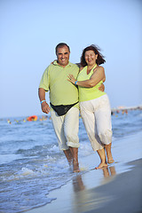 Image showing happy seniors couple  on beach