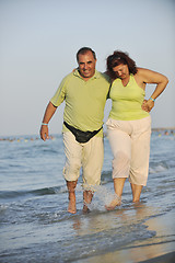 Image showing happy seniors couple  on beach