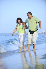 Image showing happy seniors couple  on beach