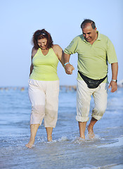 Image showing happy seniors couple  on beach