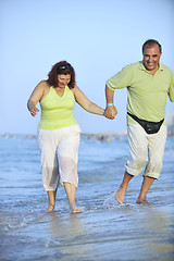 Image showing happy seniors couple  on beach