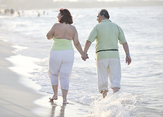 Image showing happy seniors couple  on beach