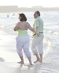 Image showing happy seniors couple  on beach