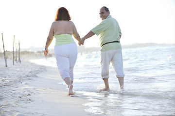 Image showing happy seniors couple  on beach