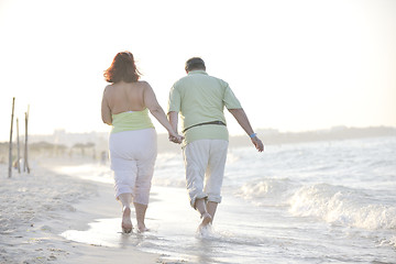 Image showing happy seniors couple  on beach