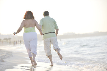 Image showing happy seniors couple  on beach