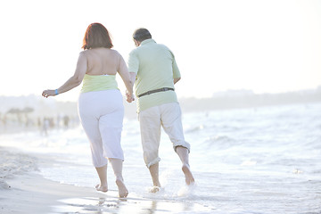 Image showing happy seniors couple  on beach