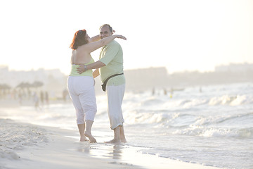 Image showing happy seniors couple  on beach