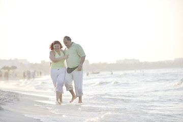 Image showing happy seniors couple  on beach