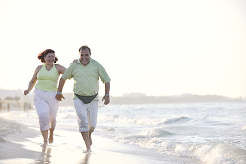 Image showing happy seniors couple  on beach