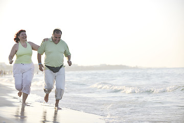 Image showing happy seniors couple  on beach