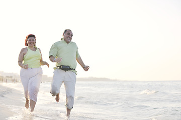 Image showing happy seniors couple  on beach