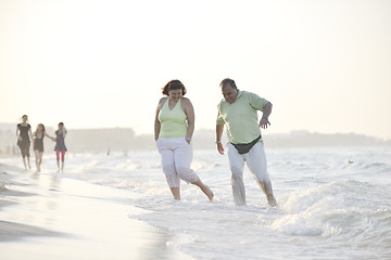 Image showing happy seniors couple  on beach