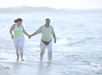 Image showing happy seniors couple  on beach