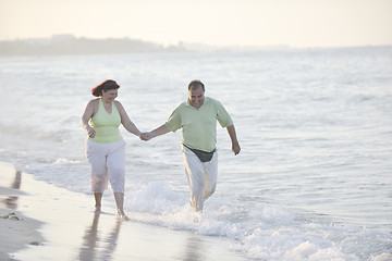 Image showing happy seniors couple  on beach