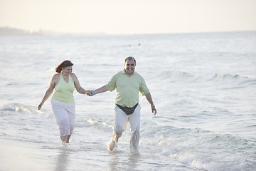 Image showing happy seniors couple  on beach