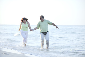 Image showing happy seniors couple  on beach