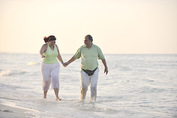 Image showing happy seniors couple  on beach