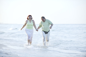 Image showing happy seniors couple  on beach