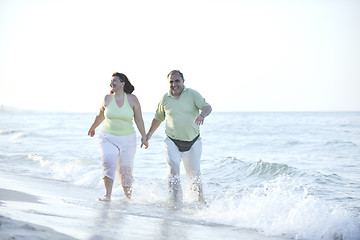 Image showing happy seniors couple  on beach