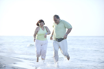 Image showing happy seniors couple  on beach