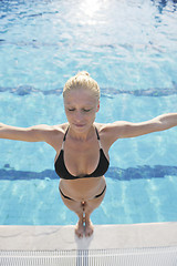 Image showing beautiful woman relax on swimming pool
