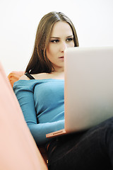 Image showing one young woman working on laptop