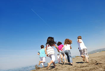 Image showing happy young  people group have fun on beach