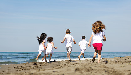 Image showing happy child group playing  on beach