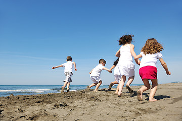 Image showing happy child group playing  on beach