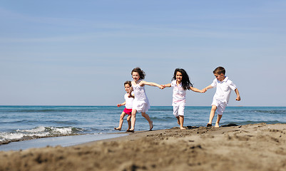 Image showing happy child group playing  on beach