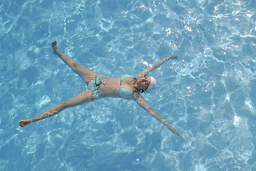 Image showing woman relax at swimming pool 