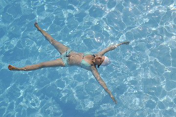 Image showing woman relax at swimming pool 