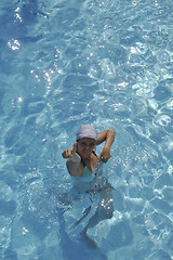 Image showing woman relax at swimming pool 