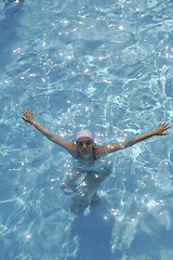 Image showing woman relax at swimming pool 